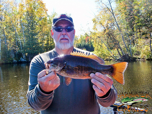 Jr. with a nice Smallie by Warmwater Chronicles